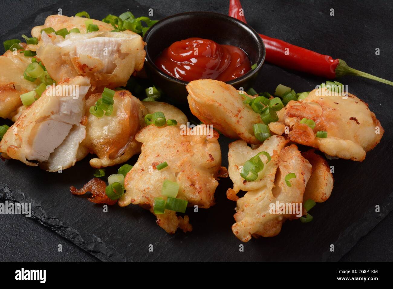 Golden crispy fried chicken fillet. Fried chicken pieces lightly battered, deep fried food Stock
