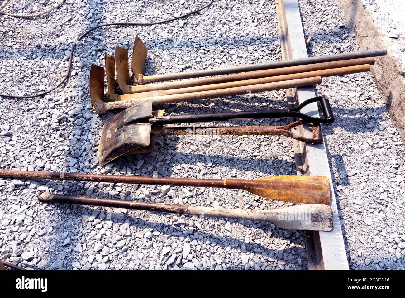 A group of shovels in the ground in the construction site. Earthwork ...