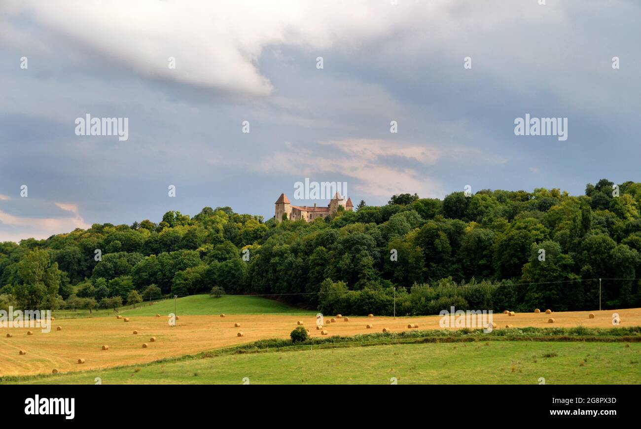 Beautiful countryside landscape under a stormy sky with a castle. Stock Photo