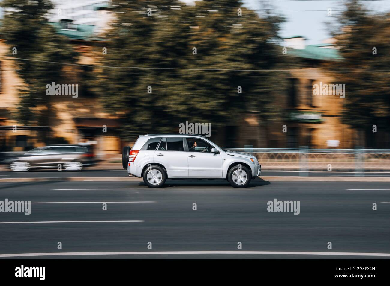 Ukraine, Kyiv - 16 July 2021: White Suzuki Grand Vitara car moving on the street. Editorial Stock Photo