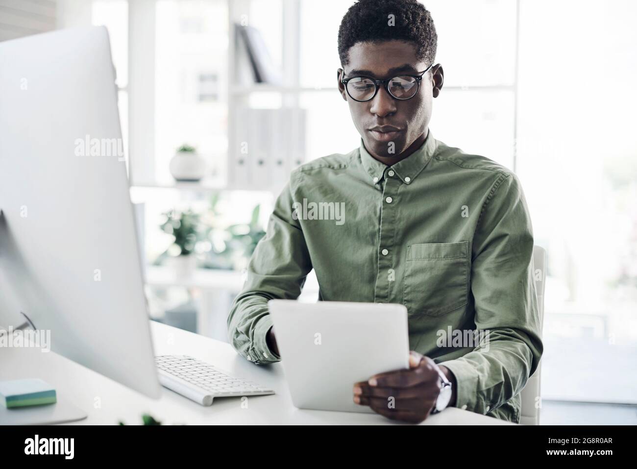 Technology allows him to get a better grip on business Stock Photo