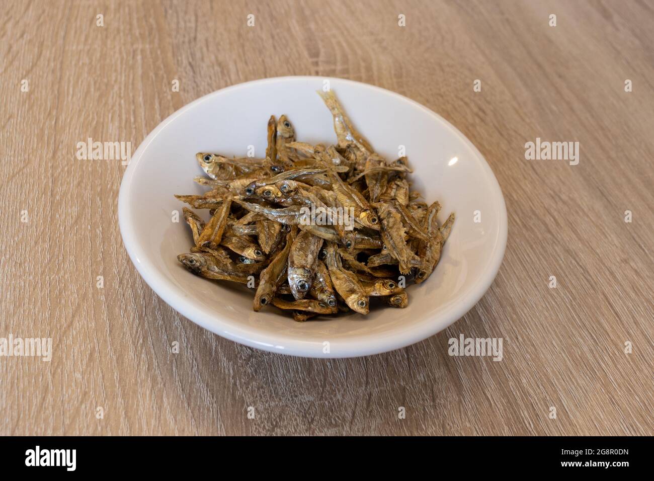 Top view of dry charales over a white plate. Dried charales. Dried fish. Stock Photo