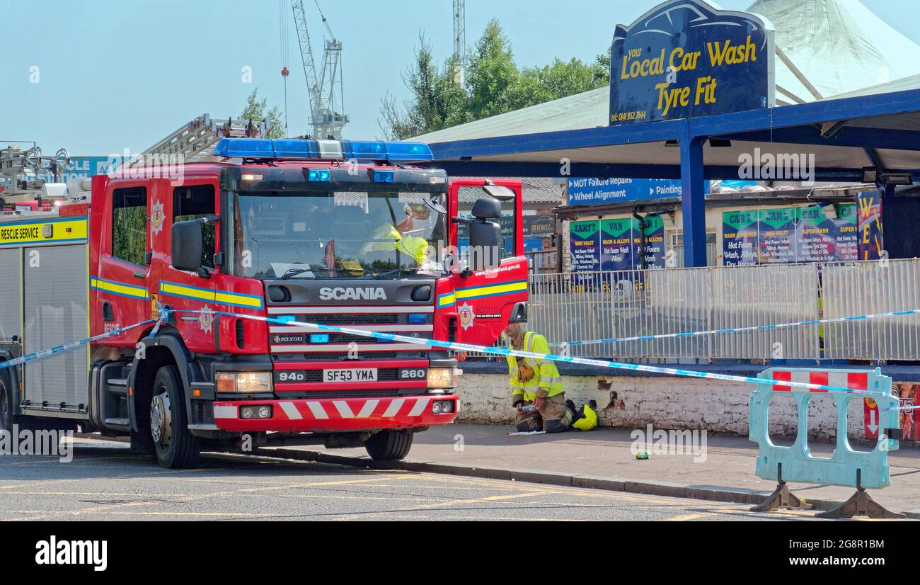 Clydebank, Glasgow, Scotland, UK,  22nd  July, 2021. Clydebank  car wash incident  Police at  an MOT garage in Dumbarton Road, at its junction with Duntocher Road in Dalmuir,.  A 36-year-old man is seriously injured after he was hit by a car. he is being treatedi hospital in govan.   A 50-year-old man has been arrested  Credit Gerard Ferry/Alamy Live  News Stock Photo