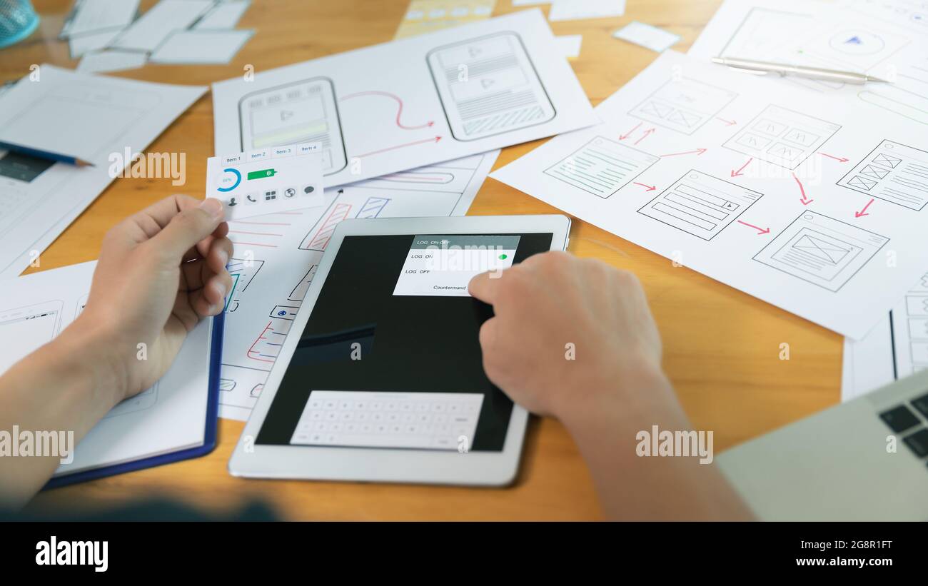 UX or UI designers designing on digital tablet and smartphone ...