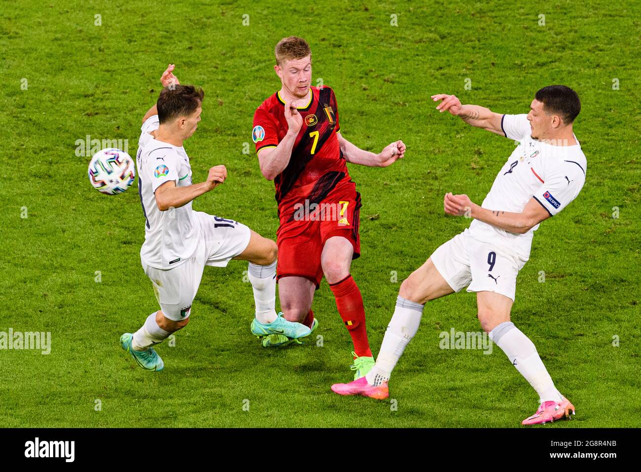 Munich, Germany - 02 July: Kevin De Bruyne of Belgium (C) battles for the ball with Andrea Belotti of Italy (R) during the UEFA Euro 2020 Championship Stock Photo