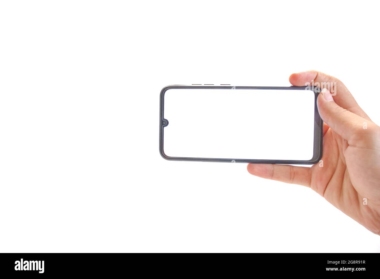 The hand holding black smartphone, blank white screen phone isolated on ...