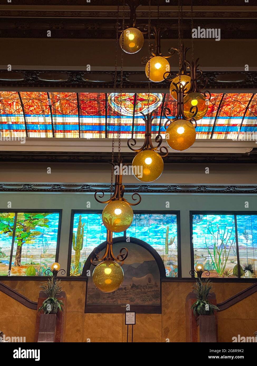 The majestic lobby stained-glass mural and art-deco lighting inside the Gadsden hotel in downtown Douglas, Arizona Stock Photo