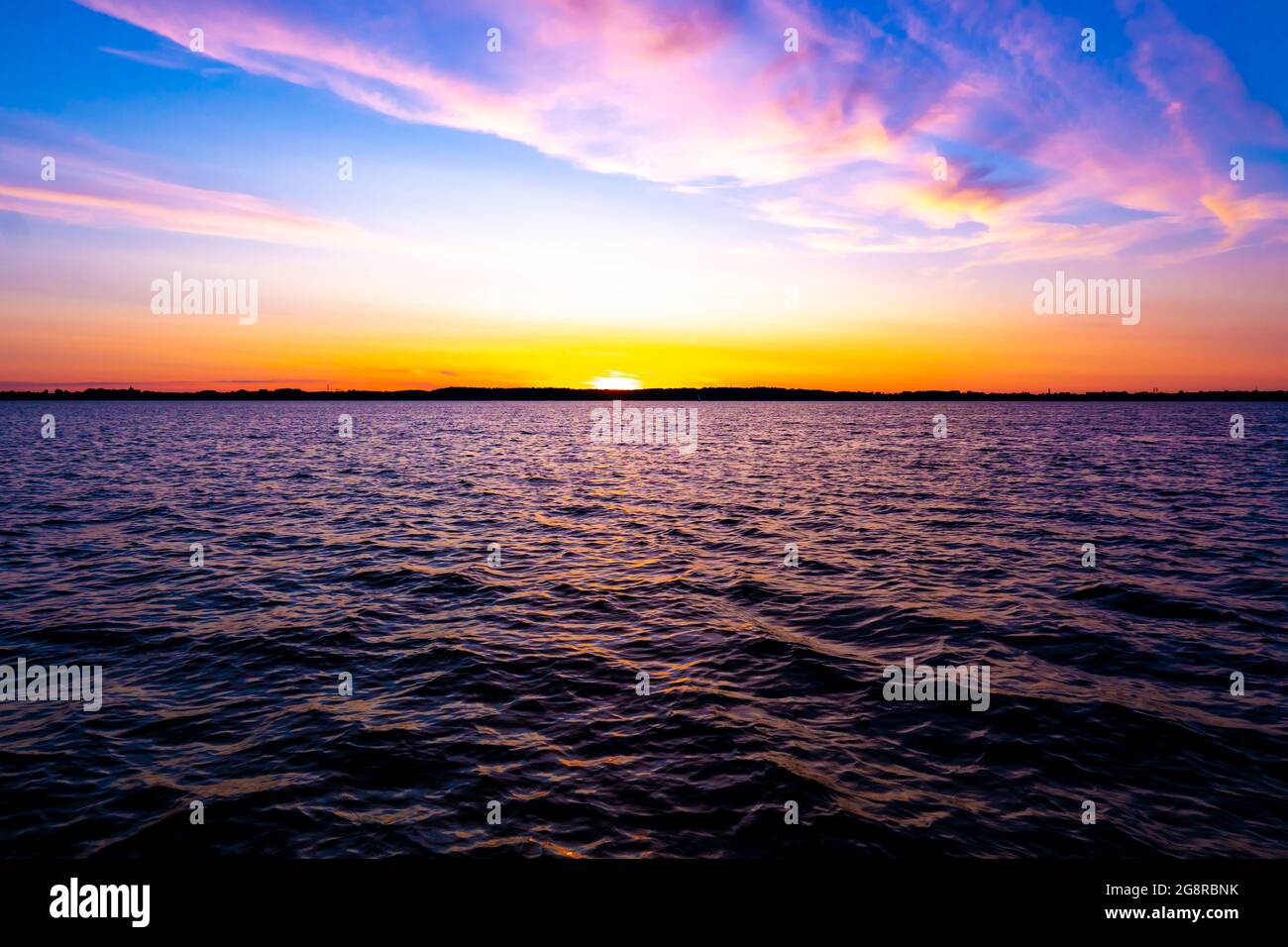 Bright beautiful sunrise or sunset at sea. Stock Photo