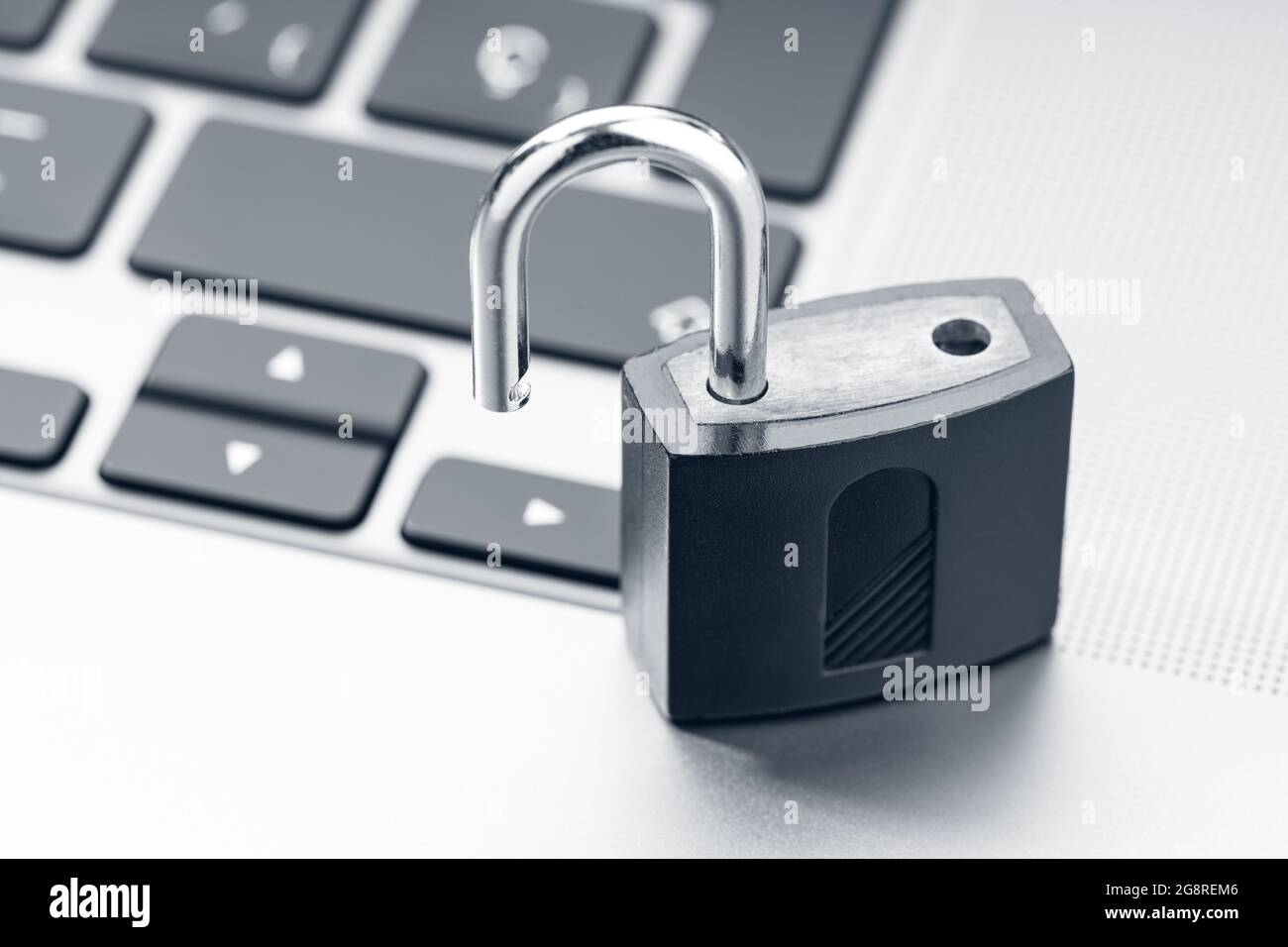 Open padlock on modern laptop. Computer Security Vulnerability concept Stock Photo