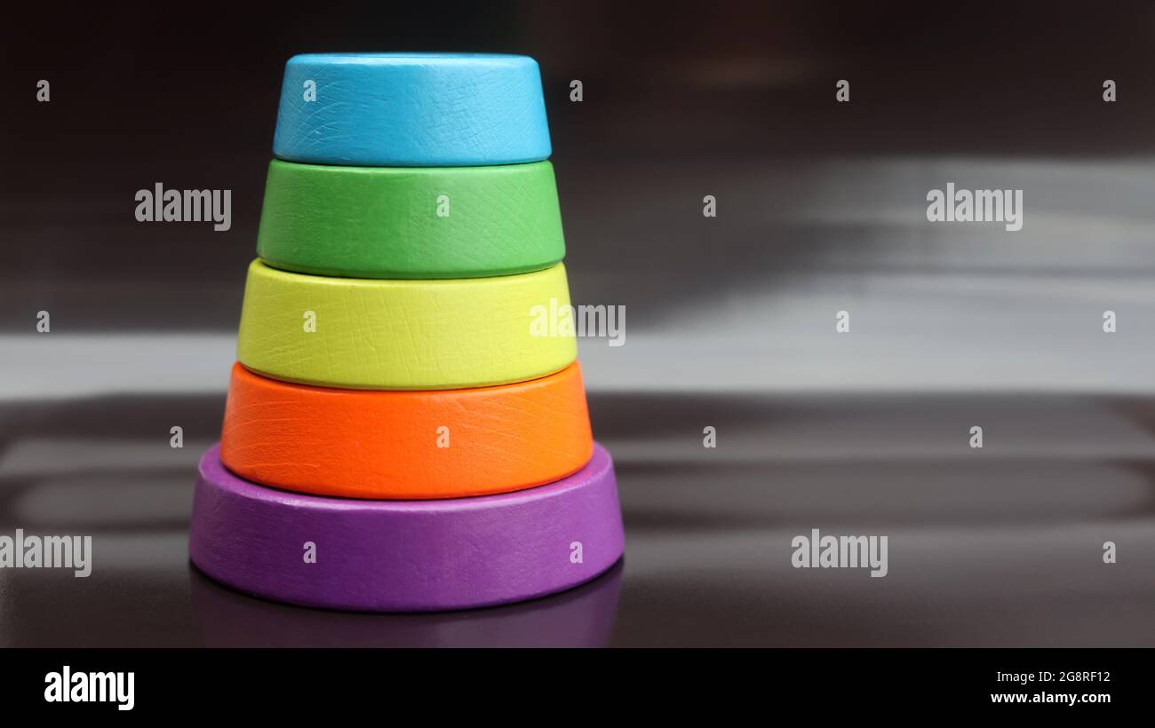 multicolor child's pyramid on black background Stock Photo