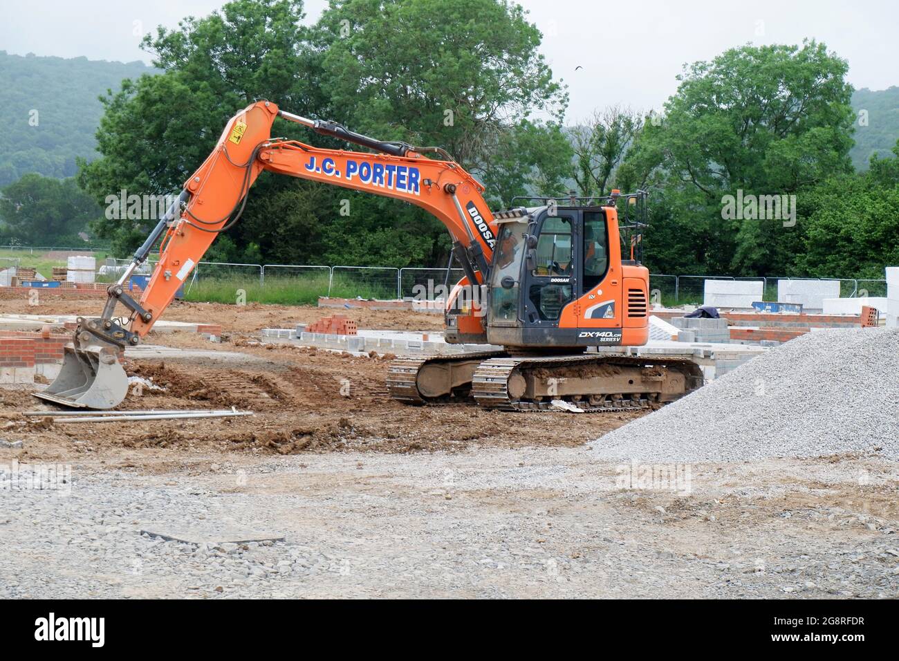 June 2021 - Large 360 hydraulic excavator parked on a new housing site in the rural Somerset village of Cheddar Stock Photo