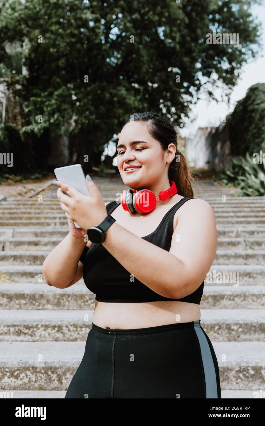 plus size young latin woman running in park in Mexico Stock Photo - Alamy