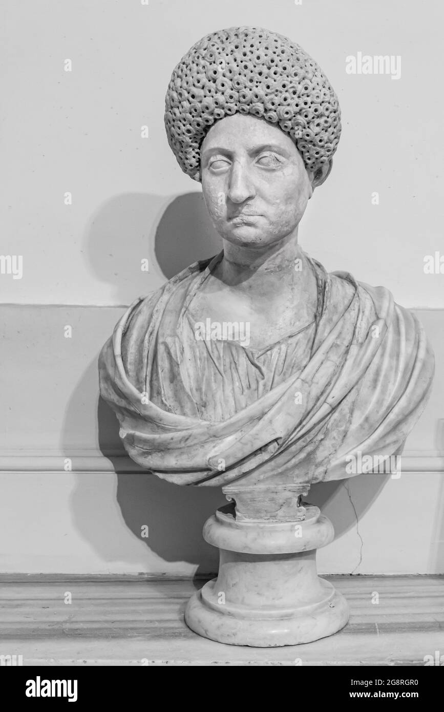 Black and white photo of ancient roman bust of senator wearing a curly wig Stock Photo