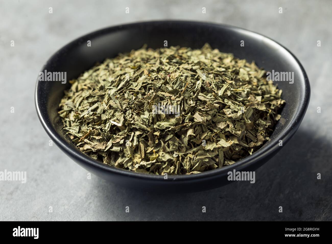 Healthy Organic Dried Basil Spice in a Bowl Stock Photo Alamy
