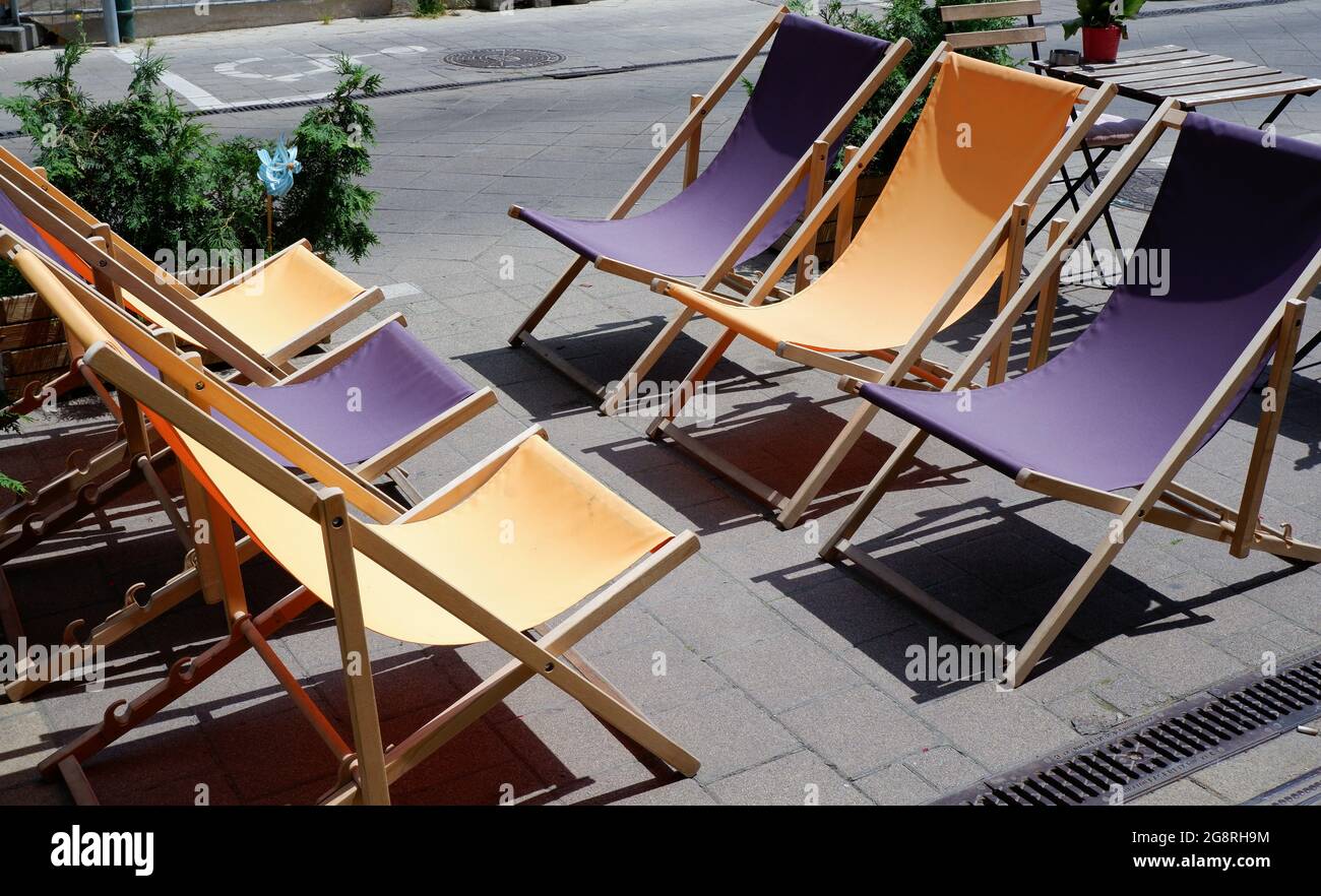 Colorful folding chairs on the street. Budapest, Hungary. Stock Photo