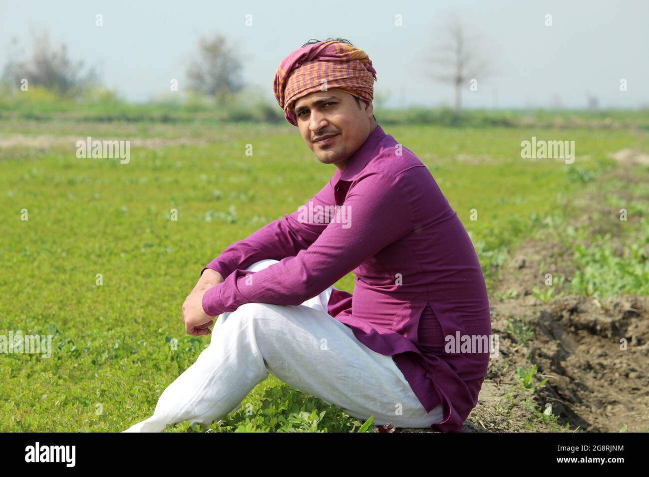 indian farmer talking phone,agricultral field Stock Photo
