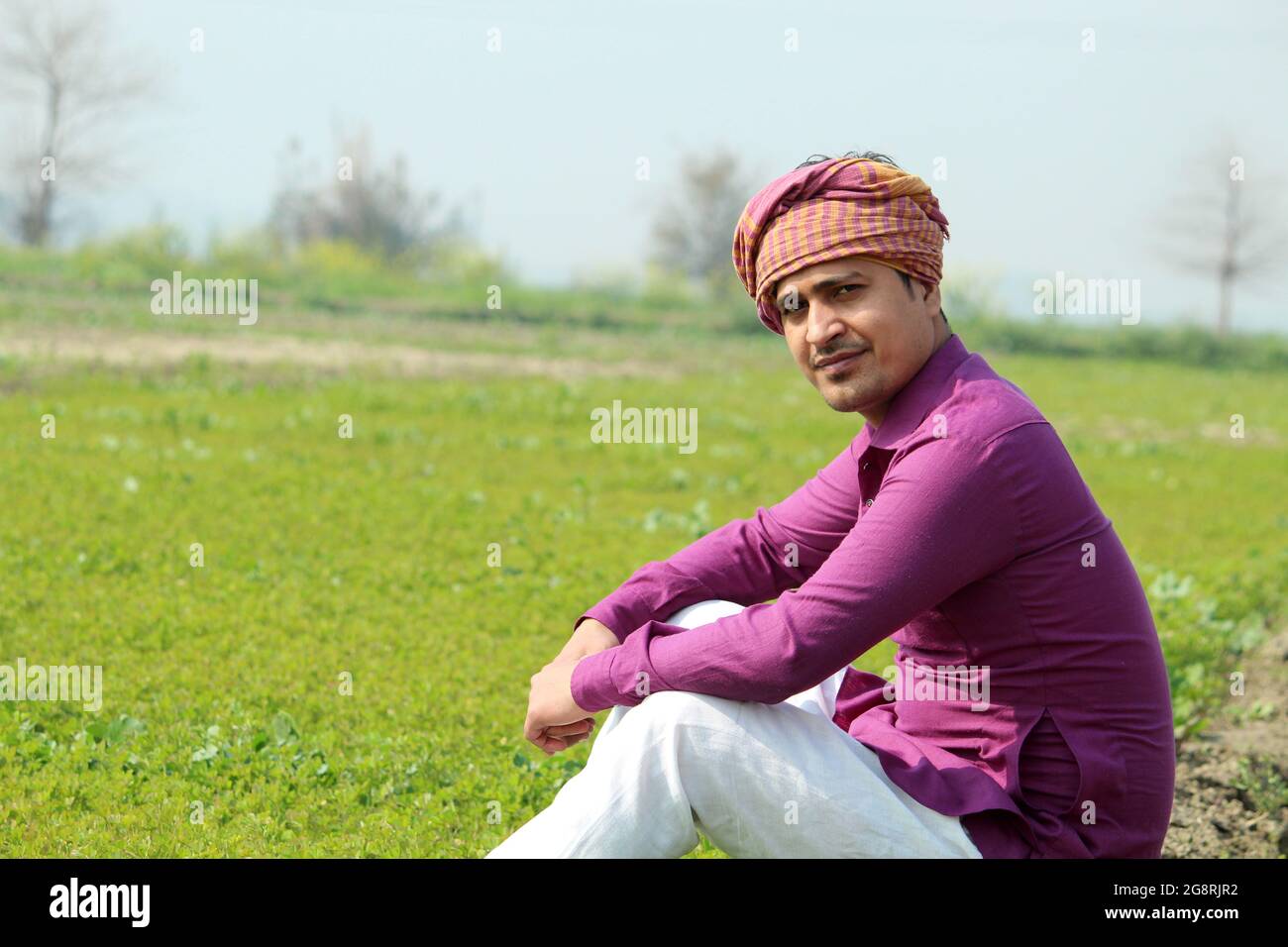 indian farmer talking phone,agricultral field Stock Photo