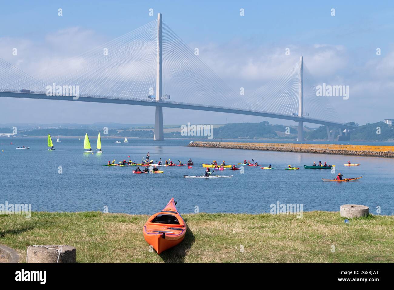 Port Edgar Marina, and Watersports centre, Firth of Forth, South Queensferry, Scotland, UK with the backdrop of the Queensferry Crossing road bridge Stock Photo