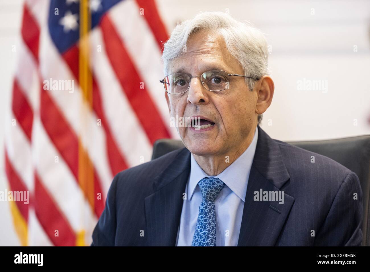 Washington, United States. 22nd July, 2021. US Attorney General Merrick Garland (R) announces the launch of the Justice Department's 'five cross-jurisdictional trafficking strike forces' to Acting Alcohol, Tobacco and Firearms (ATF) Director Marvin G. Richardson (C-L) at the ATFin Washington, DC, USA, 22 July, 2021. The strike forces will seek to reduce firearms trafficking corridors, with a focus on New York, Chicago, Los Angeles, the San Francisco Bay and Sacramento Region, and Washington, DC. Pool Photos by Jim Lo Scalzo/UPI Credit: UPI/Alamy Live News Stock Photo