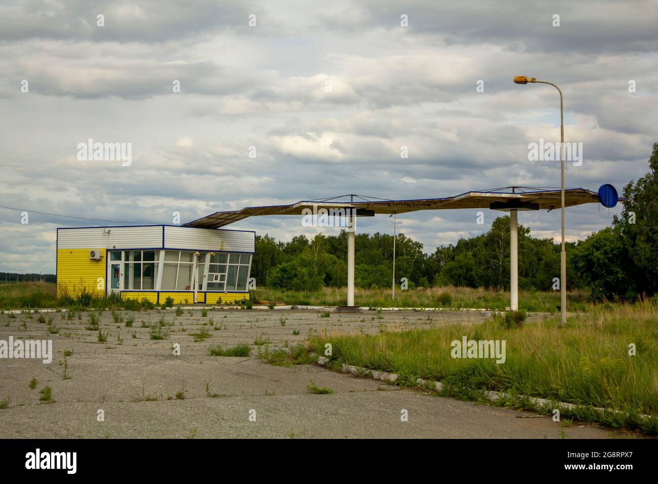 Abandoned gas station of a bankrupt small fuel company. Stock Photo