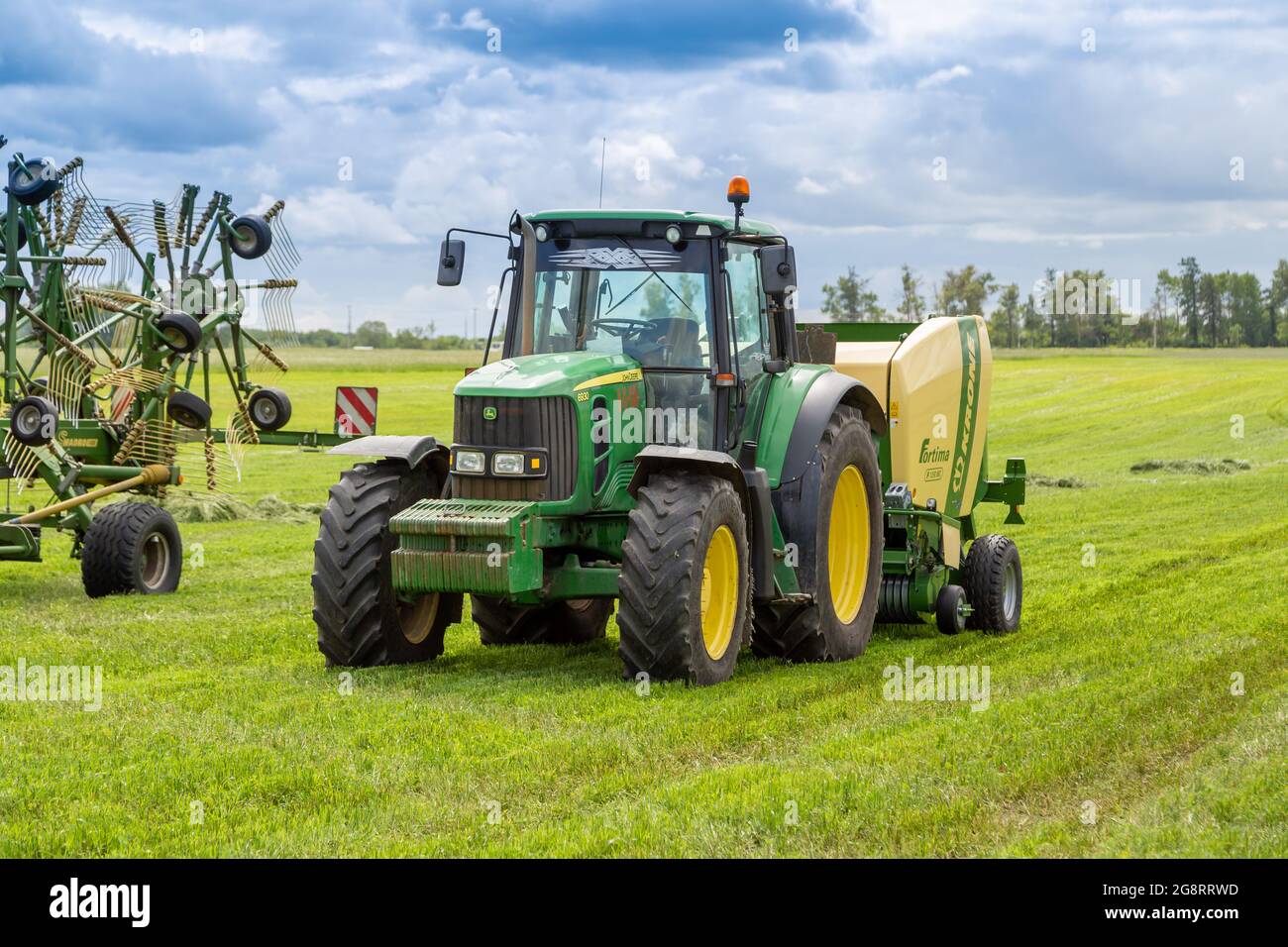 Russia, Leningrad Region June, 2019 Powerful tractor brand JOHN