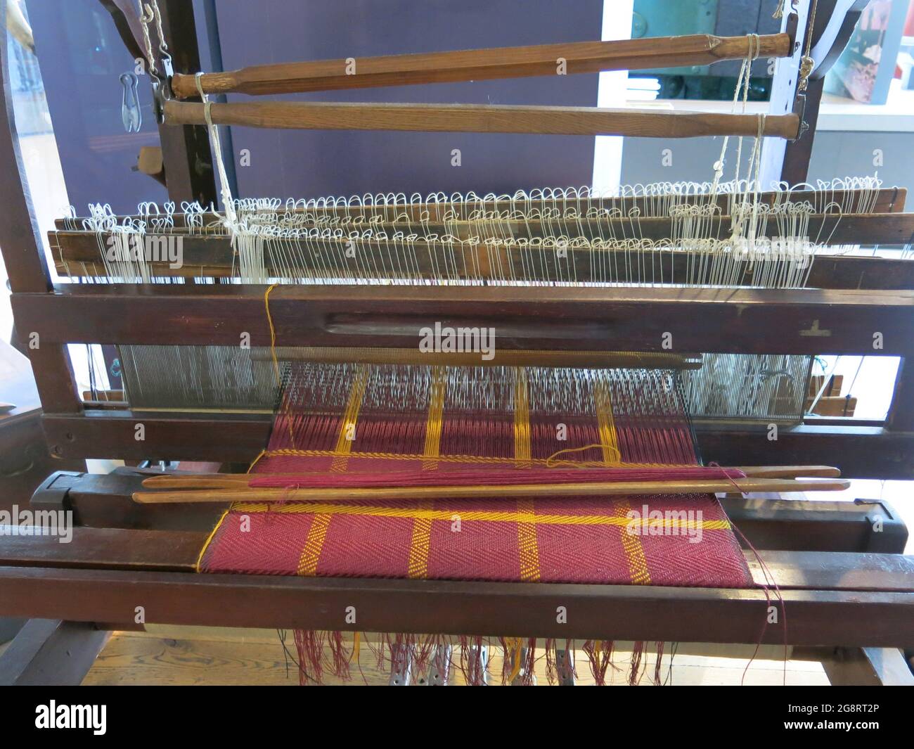 Weaving was one of the earliest industries in Lanarkshire; a loom is on display at the Summerlee Museum of Scottish Industrial Heritage. Stock Photo