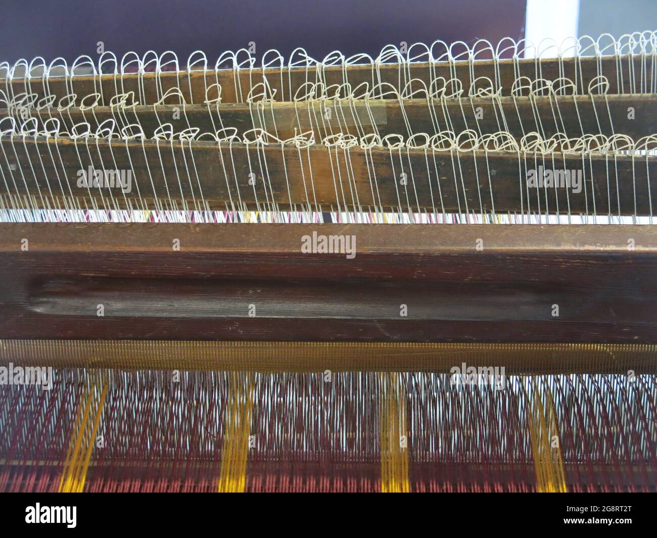 Weaving was one of the earliest industries in Lanarkshire; a loom is on display at the Summerlee Museum of Scottish Industrial Heritage. Stock Photo