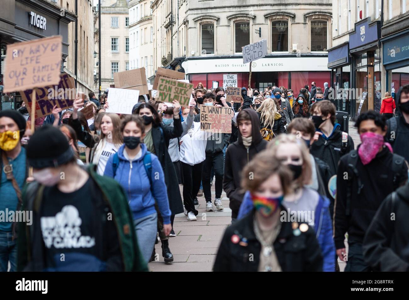 Bath, UK. 27th March 2021. Approximately 200 mostly young protesters took to the streets of historic Bath in North Somerset to demonstrate against the police & crime bill. The group of demonstrators initially gathered at Bath Abbey before marching through the streets of the city centre shouting “kill the bill” and “who's streets, our streets”. A small number of police accompanied the march which went ahead peacefully and without incident. Stock Photo