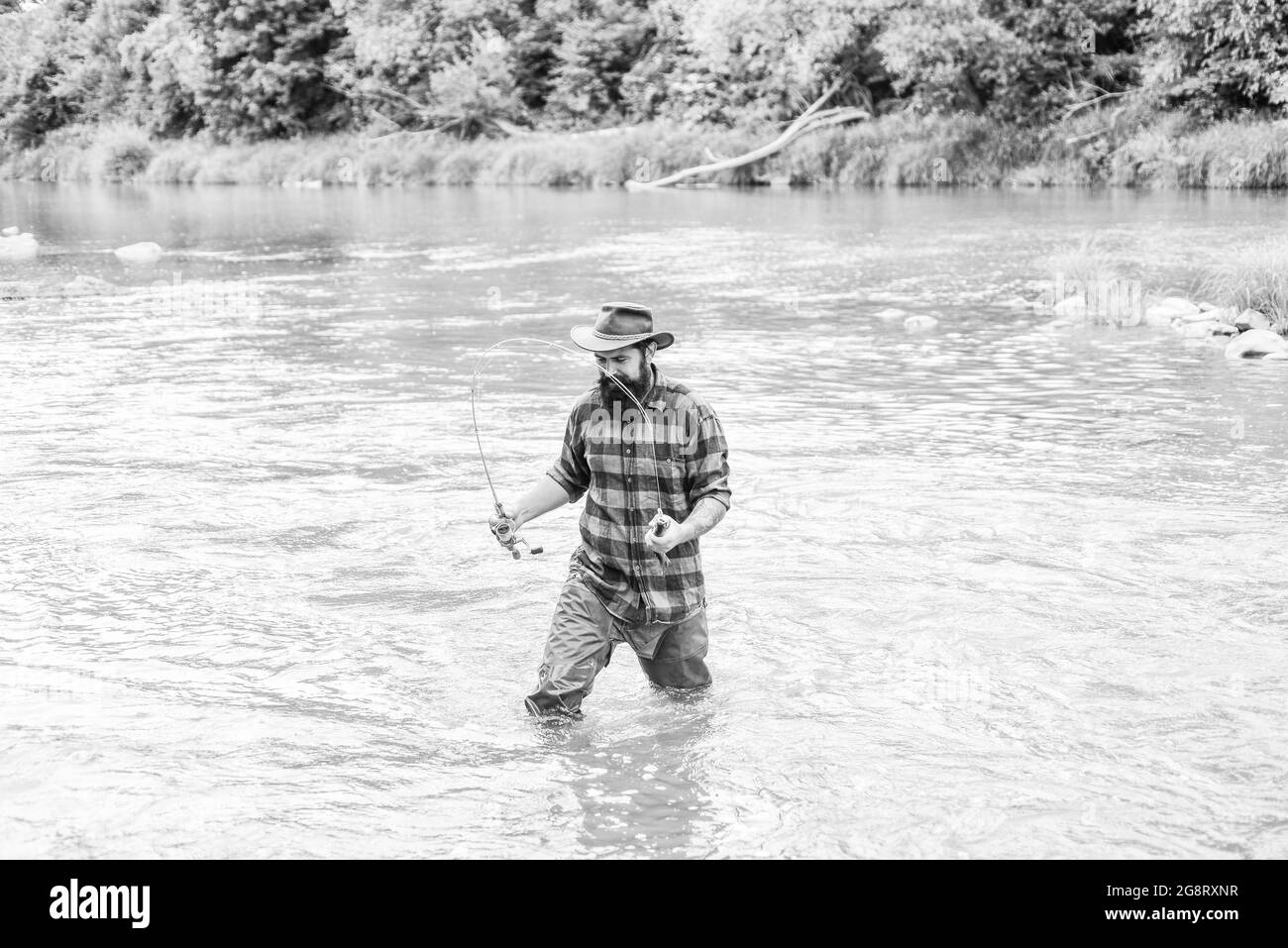 Spinning and fly fishing equipment Black and White Stock Photos