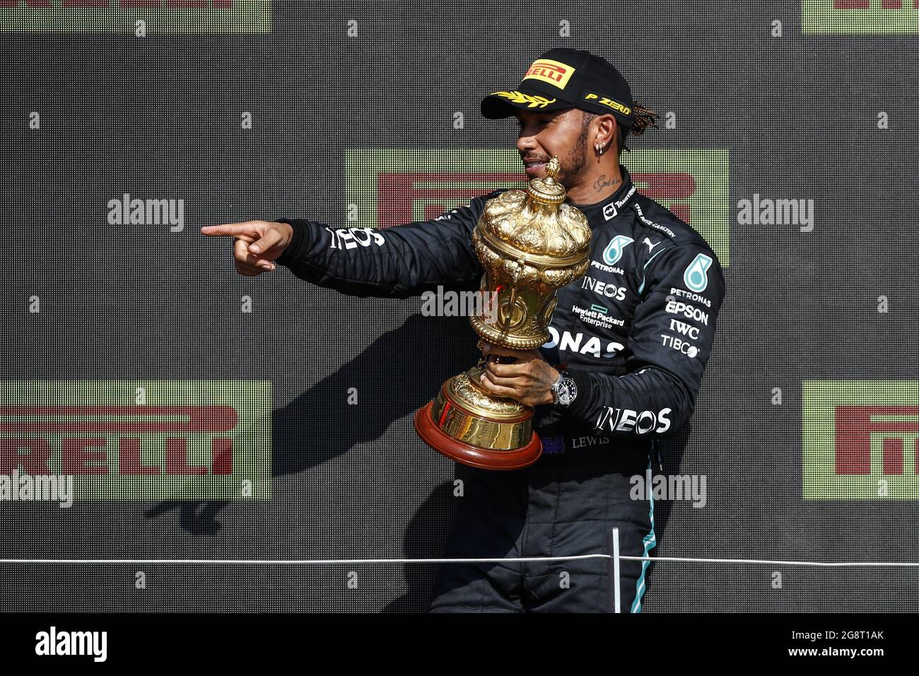 HAMILTON Lewis (gbr), Mercedes AMG F1 GP W12 E Performance, portrait  celebrating his victory at the podium with the trophy during the Formula 1  Pirelli British Grand Prix 2021, 10th round of