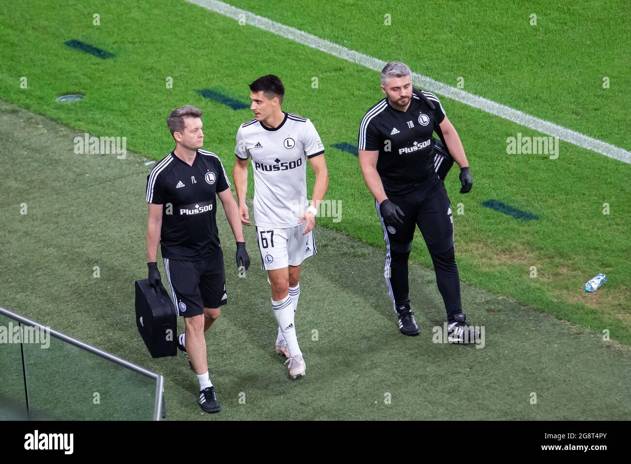 Warsaw, Poland. 21st July, 2021. The injured Bartosz Kapustka of Legia leaves the field during the UEFA Champions League Second Qualifying Round match between Legia Warszawa and FC Flora Tallinn at Marshal Jozef Pilsudski Legia Warsaw Municipal Stadium. (Final score; Legia Warszawa 2:1 FC Flora Tallinn) Credit: SOPA Images Limited/Alamy Live News Stock Photo