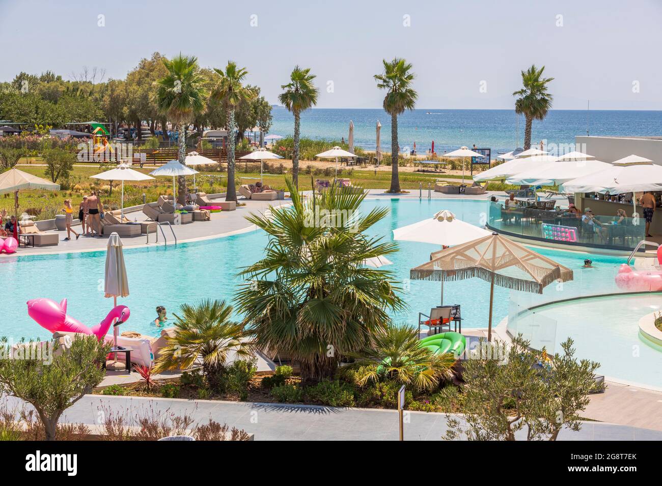 Beautiful view of swimming pool and pool bar of Portes Lithos Luxury Resort.  Greece. Nea Potidaea Stock Photo - Alamy