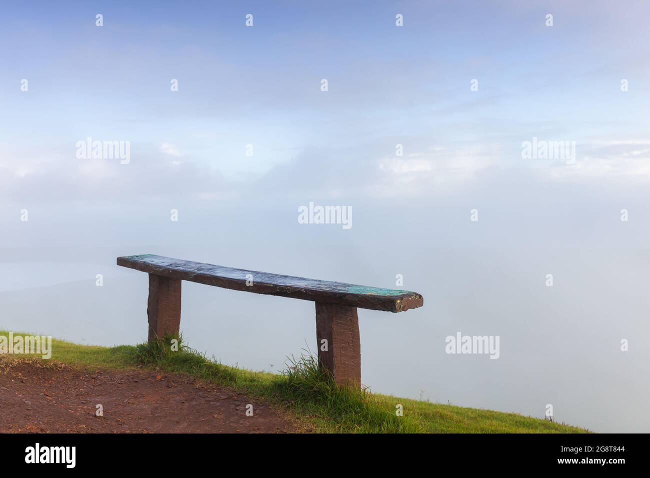 Empty wooden bench stands on the top of Montana Redonda. Dominican Republic Stock Photo