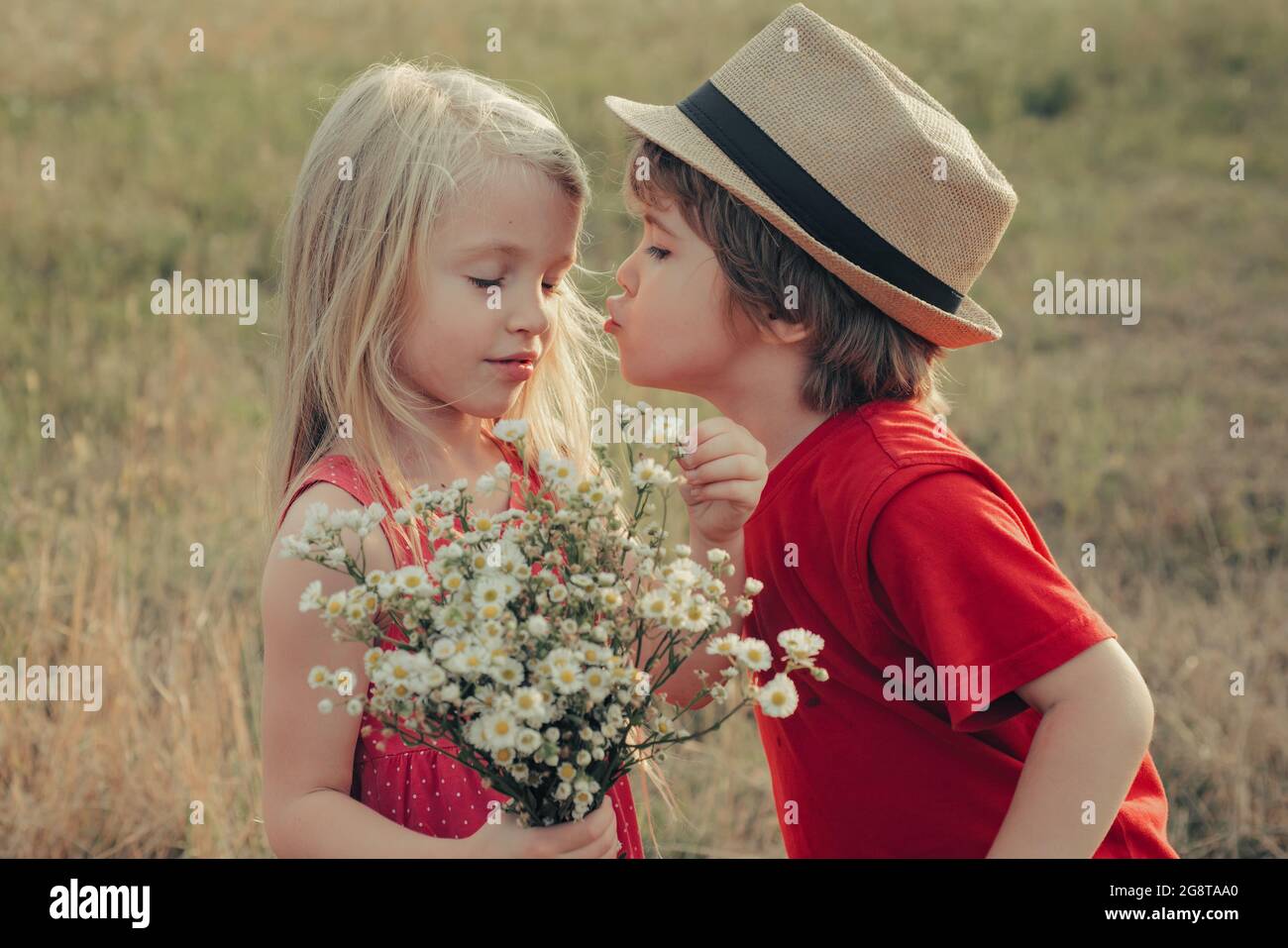 Lovely children. Kids Love story, kiss. Beautiful little couple ...