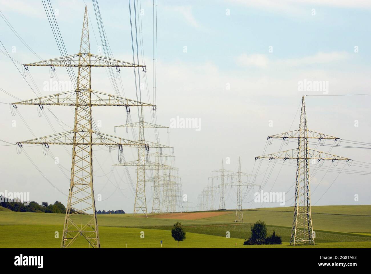 Pylons in field landscape, Germany, Baden-Wuerttemberg, Vaihingen/Enz Stock Photo