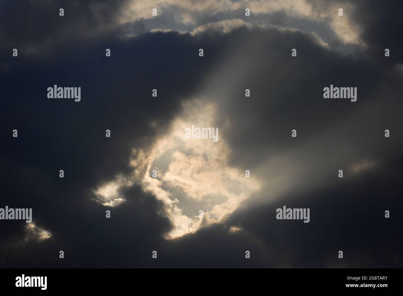 sun shines through clouds, Germany Stock Photo