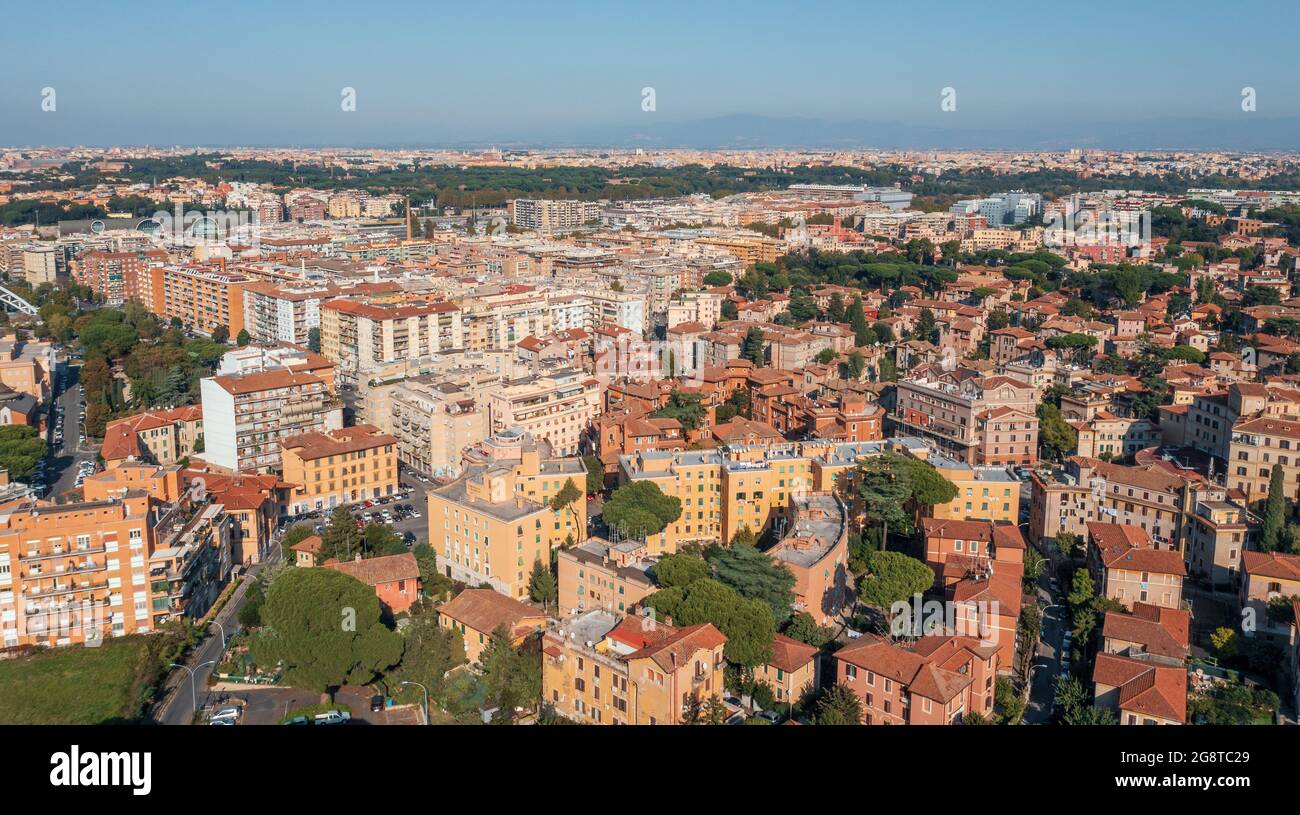 Typical Rome cityscape aerial panorama, Italy. Residential buildings with orange roofs. Stock Photo