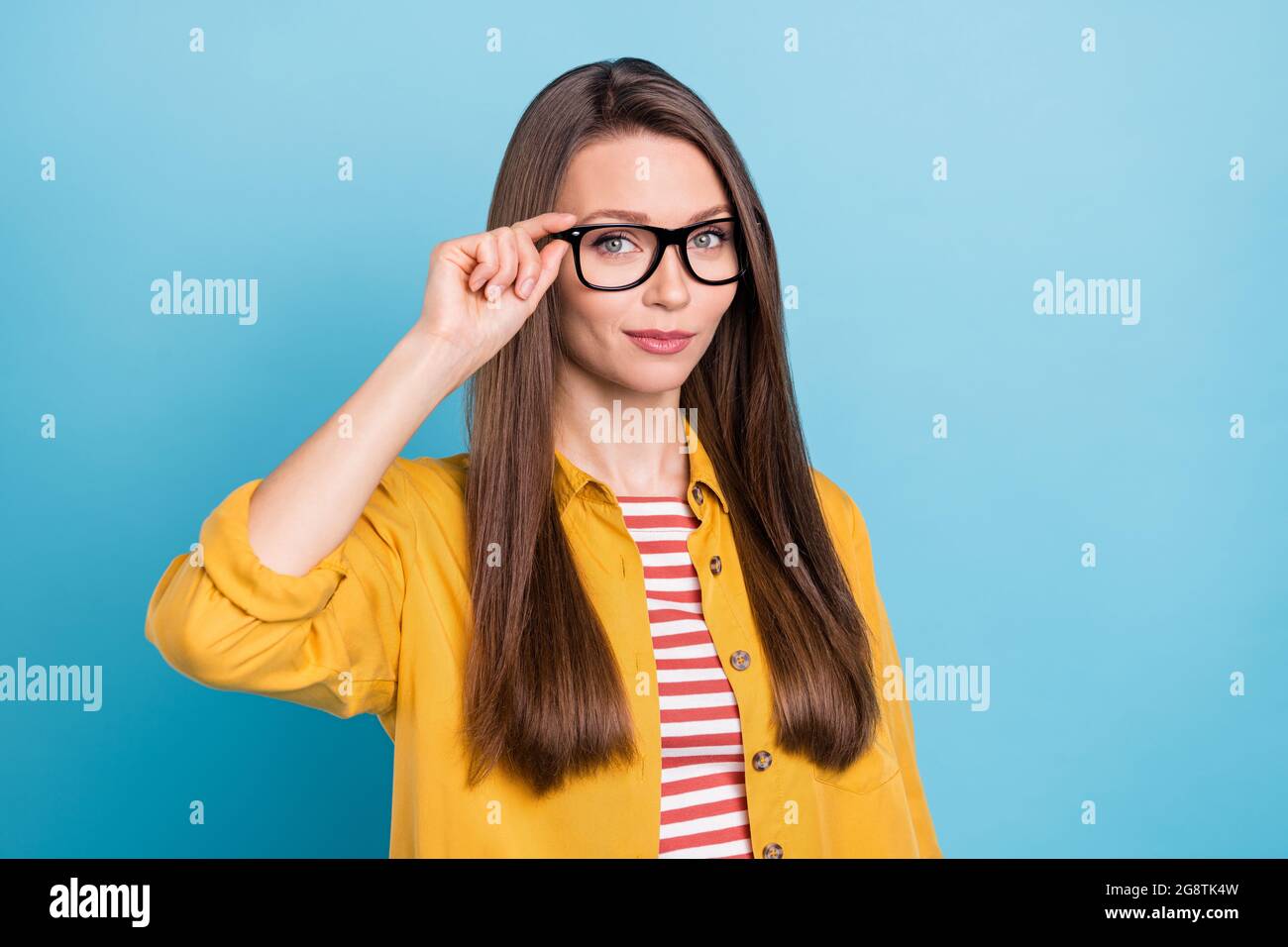 https://c8.alamy.com/comp/2G8TK4W/photo-of-young-attractive-woman-happy-positive-smile-hand-touch-eyeglasses-isolated-over-blue-color-background-2G8TK4W.jpg