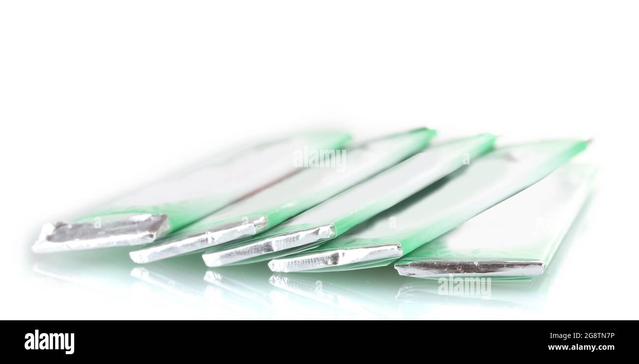 single chewing gum wrapped in standard packaging isolated on white