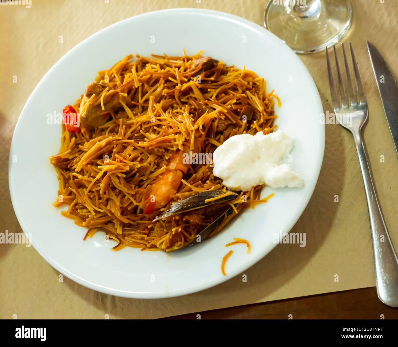 a spanish fideua, a typical noodles casserole with seafood Stock Photo -  Alamy