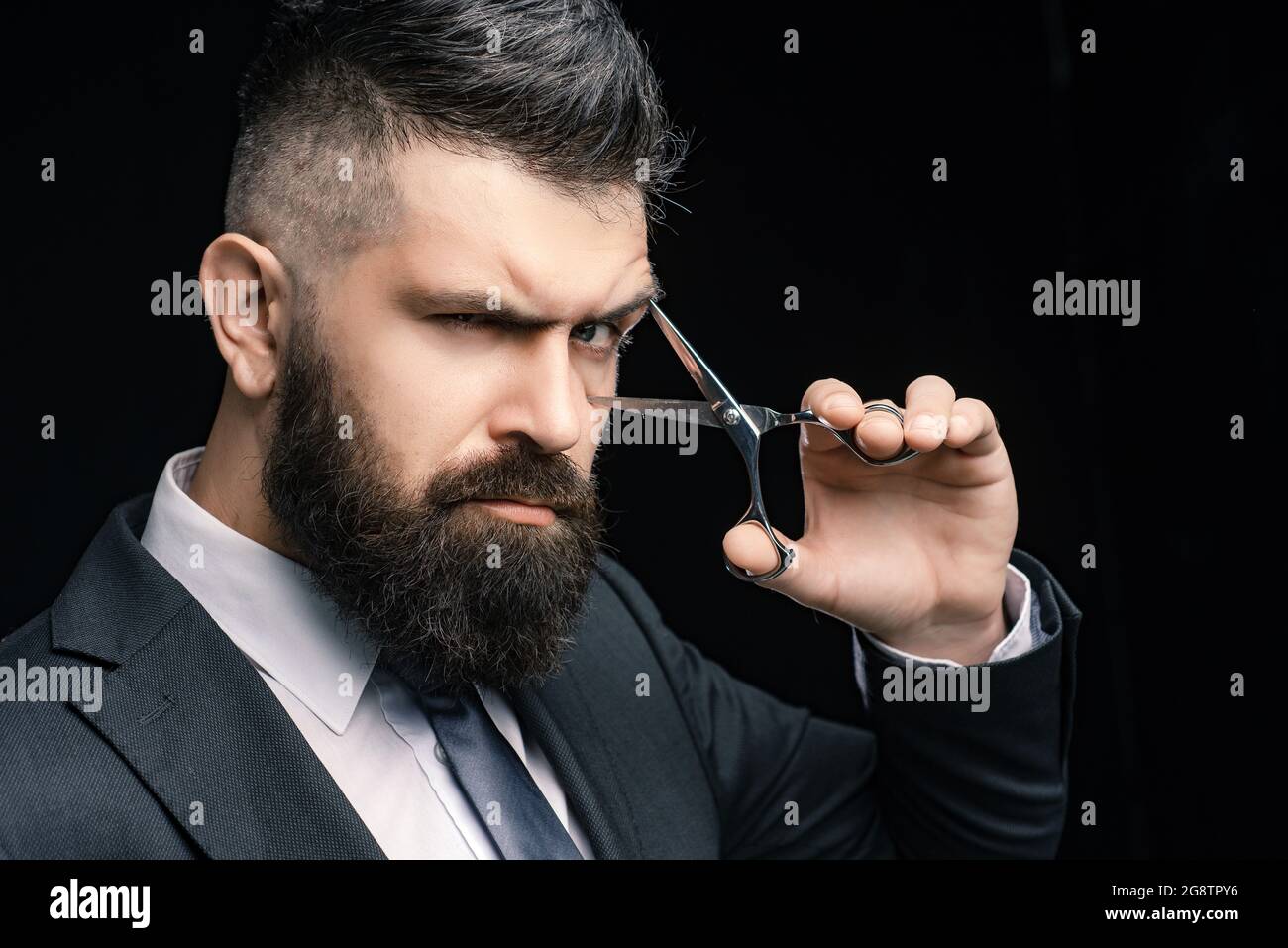 Perfect beard. Haircuts for men. Stylish and hairstyle. Hair salon and  barber vintage. Barber shop. Barber on black background with scissors Stock  Photo - Alamy