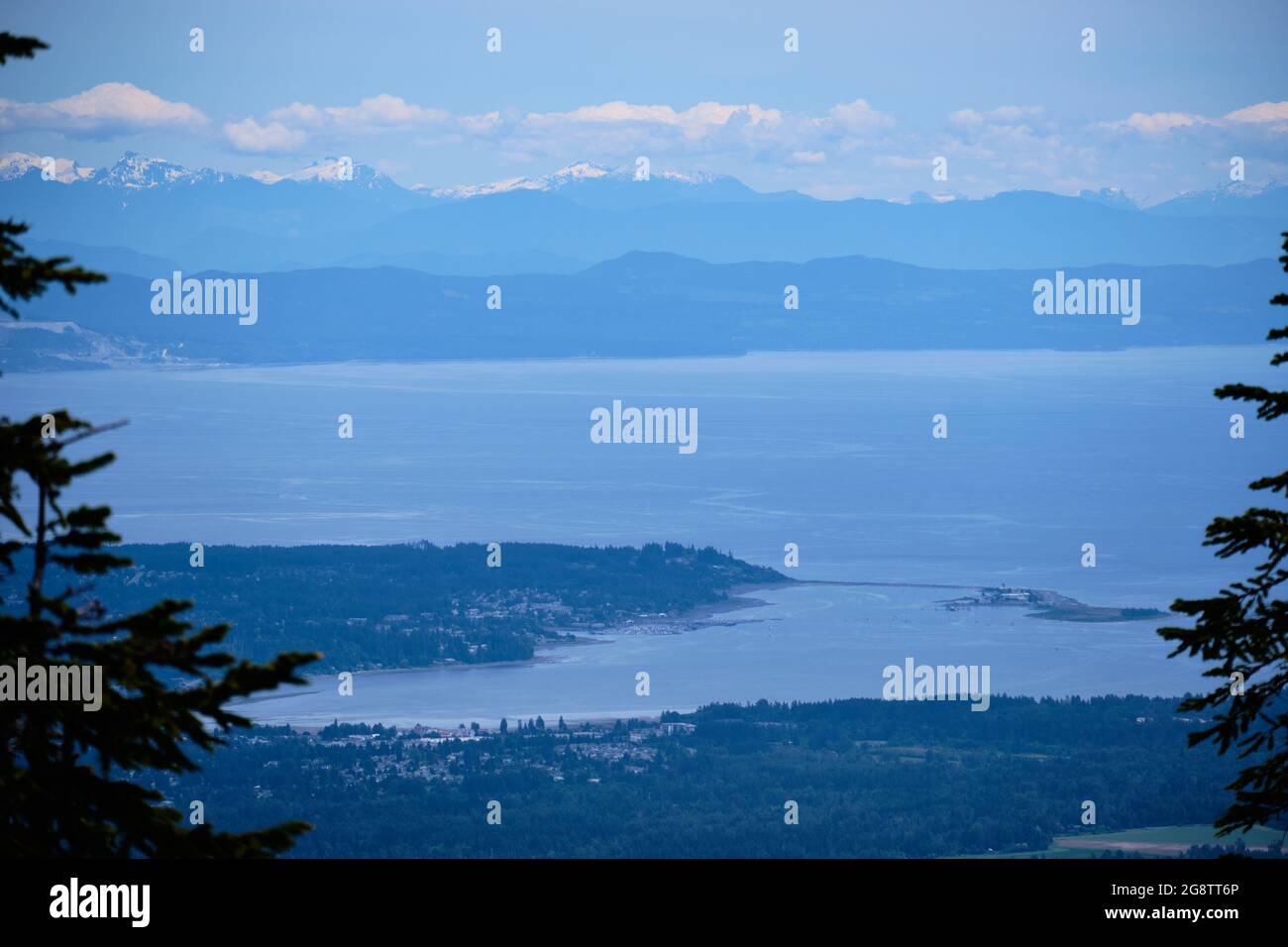 Looking down on Courtenay and Comox from Forbidden Plateau on Vancouver Island, BC.  Across Georgia Strait lies Texada Island and BC Mainland Stock Photo