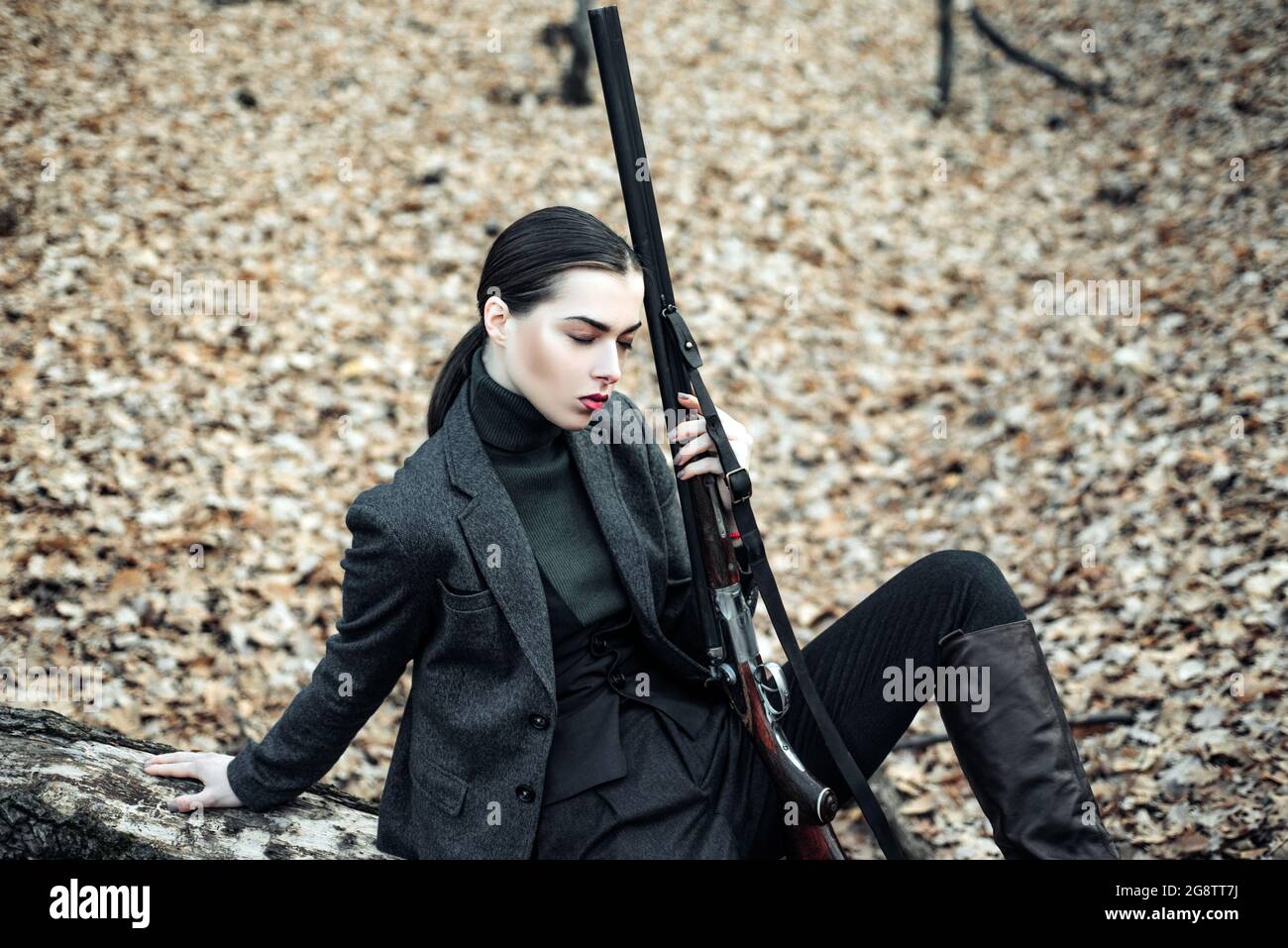 Female hunter in forest. successful hunt. hunting sport. girl with