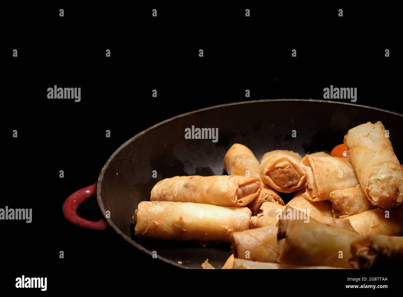 deep fried spring rolls  surve on the pan in dark background Stock Photo