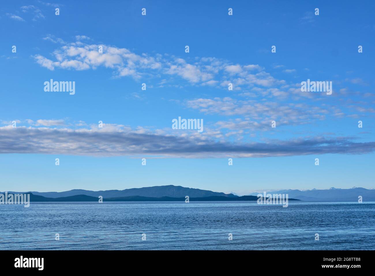 Many shades of blue:  Looking across Georgia Strait from Rathtrevor Provincial Park on Vancouver Island to islands of Texada and Lasqueti. Stock Photo
