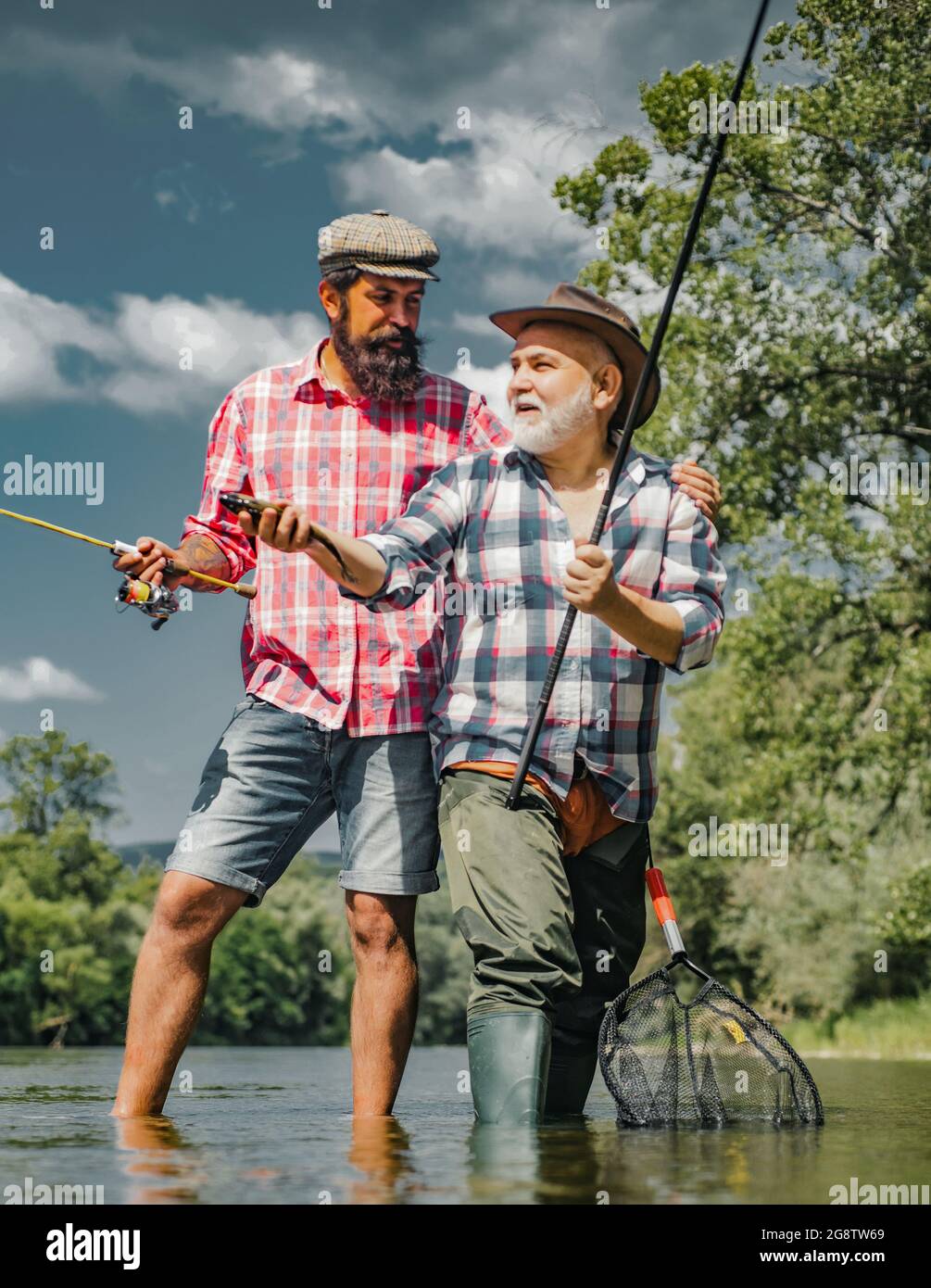 Boy father grandfather fishing hi-res stock photography and images