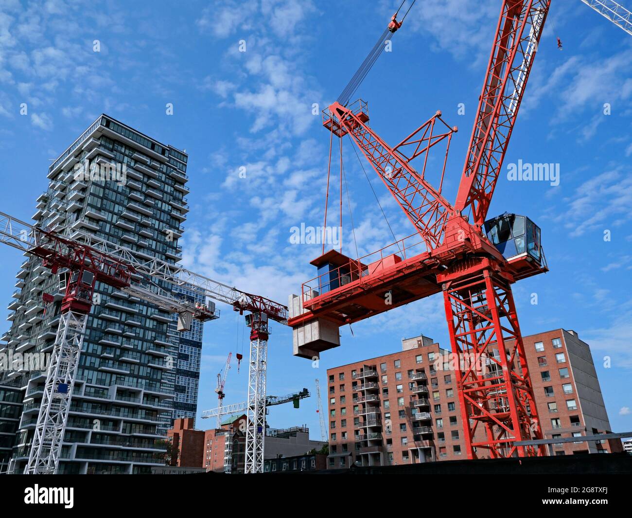 construction site with multiple cranes for construction of a new high rise apartment building Stock Photo