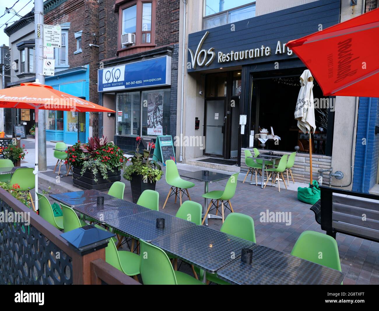 Part of the road is taken over by restaurants on a main street in  Toronto, as outdoor dining is safer during the pandemic. Stock Photo
