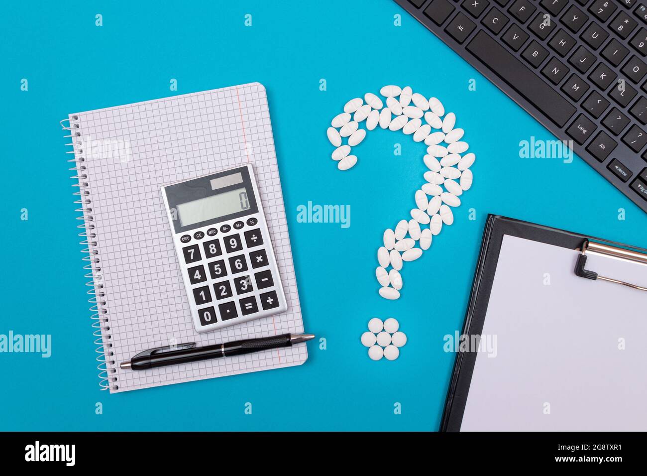 Treatment Costs and Budget. Question Mark Made from White Pills and Tablets  with Calculator and Notepad, Lying on Blue Background. Global  Pharmaceutical Industry and Medicinal Products Stock Photo - Alamy