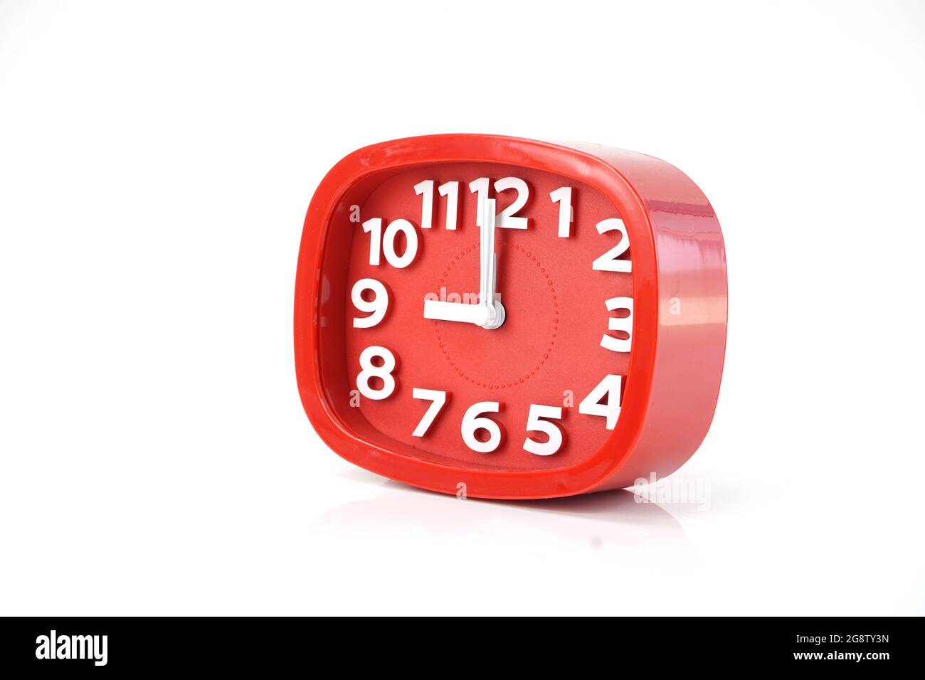 red alarm clock isolated on white background Stock Photo - Alamy